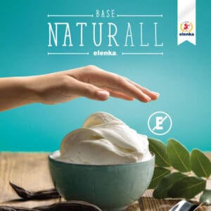A hand hovers over a bowl of creamy, whipped dessert set against a turquoise background. The words "Base Naturall elenka" appear above. A small Elenka logo is at the top right. Green leaves and vanilla pods surround the bowl.