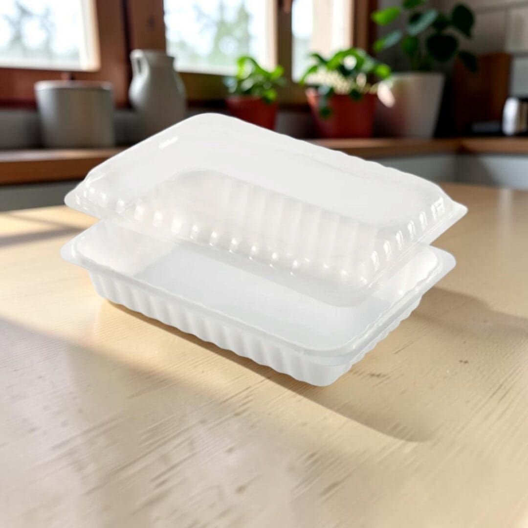 Alcas Porzionabile take-out gelato container with clear lid on kitchen table